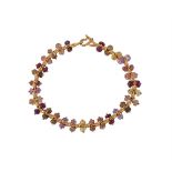 A gold coloured beaded bracelet