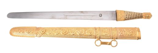 A cased Omani gold coloured mounted scabbard and sword