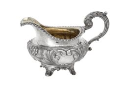 A William IV silver circular cream jug by Benjamin Stephens