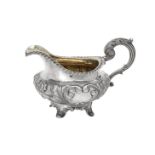 A William IV silver circular cream jug by Benjamin Stephens