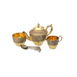Y A cased Victorian silver gilt three piece tea set by Elkington & Co. Ltd.