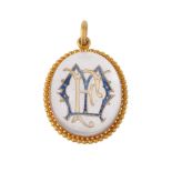 A late Victorian reverse painted intaglio pendant