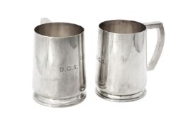 A pair of silver pint mugs by William Suckling Ltd.