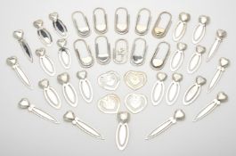 A collection of silver heart book marks and clips