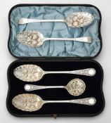 A cased pair of Victorian silver berry spoons and a sifting spoon by William Hutton & Sons Ltd.