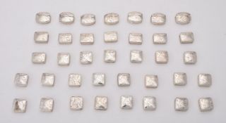 A collection of silver pill boxes