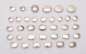 A collection of assorted silver pill boxes