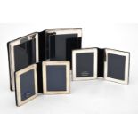 Three silver mounted folding double photo frames by Kitney & Co.