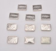 A collection of silver rectangular boxes