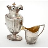 Y A Victorian silver shaped oval and fluted jug by Robert Harper