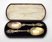 A cased pair of matched continental silver spoons