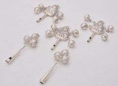 Three silver coloured baby rattles and whistles