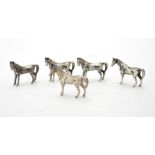 Four silver models of horses