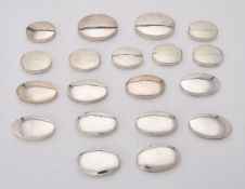 A collection of plain silver oval boxes