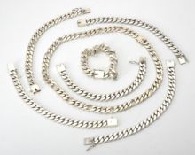A silver Figaro link necklace