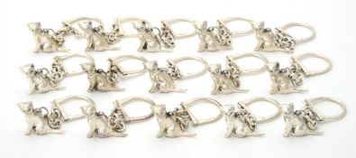 A collection of silver cat key rings