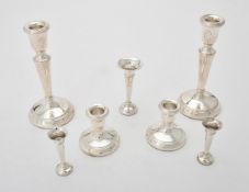 A matched pair of silver candlesticks by Ari D. Norman and L. J. Millington