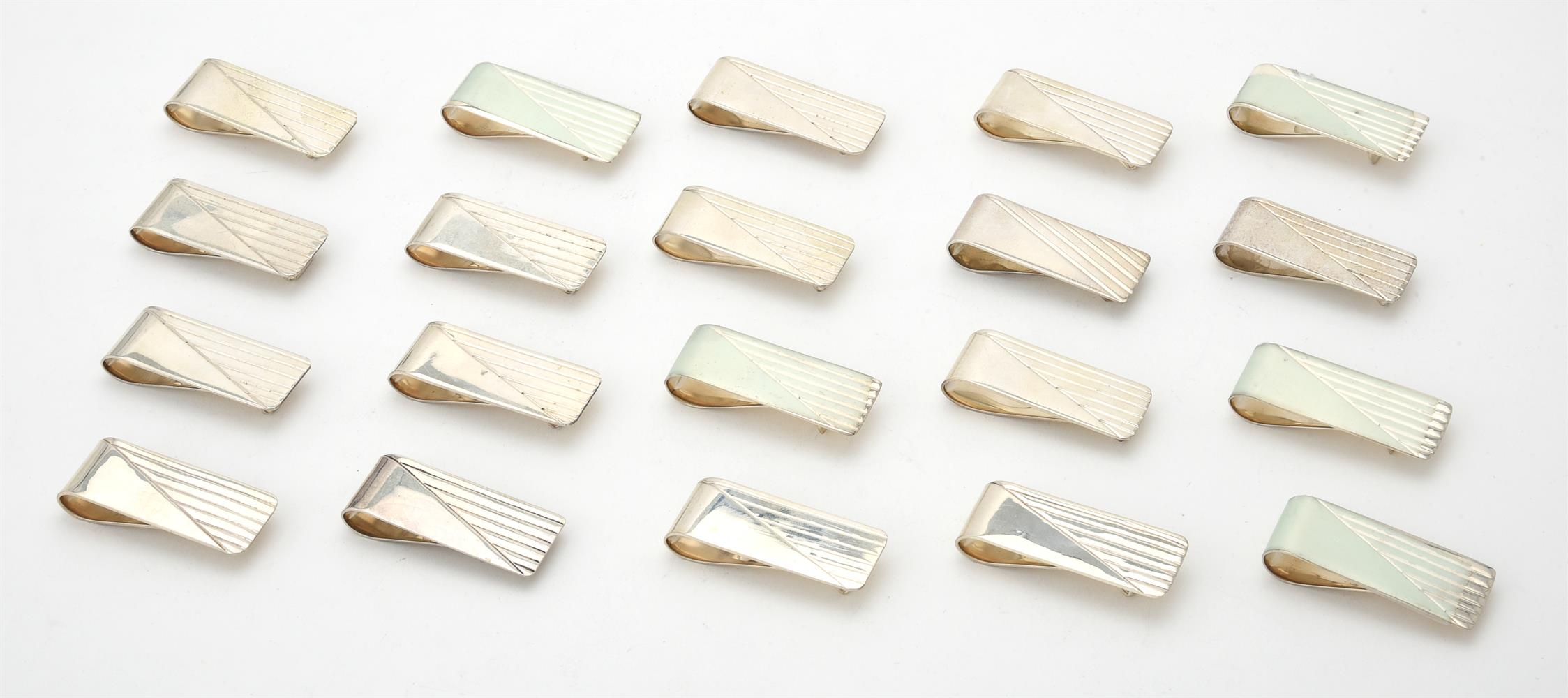 A collection of silver rectangular money clips