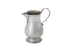 An American silver coloured baluster cream jug by Cartier