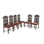 A set of six Victorian stained and carved oak dining chairs in Carrollian style