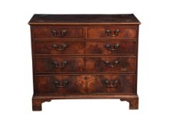 A George III mahogany and inlaid chest of drawers