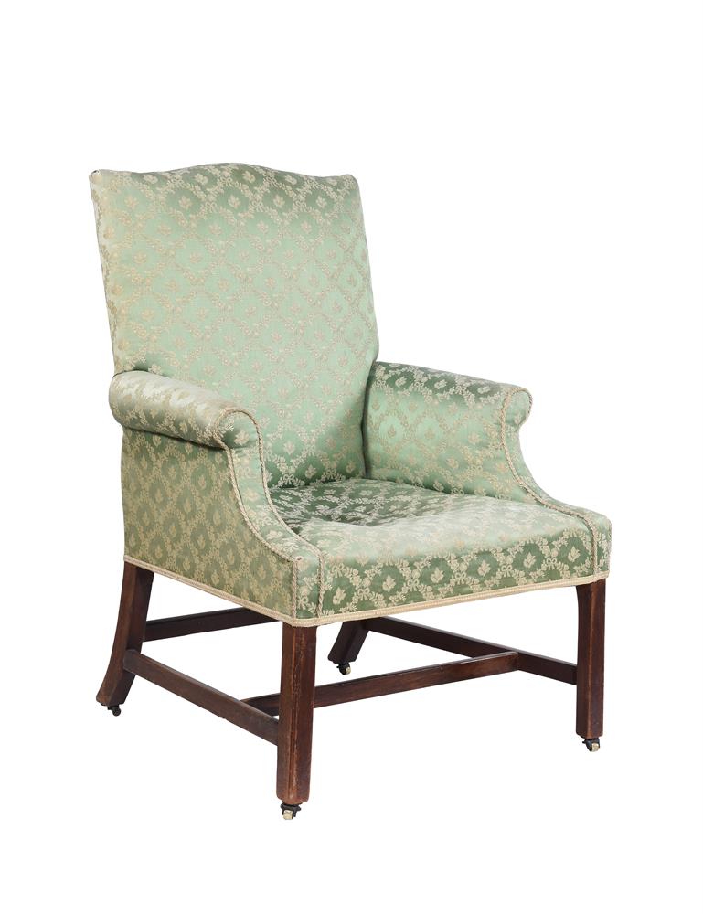 A George III mahogany and upholstered armchair