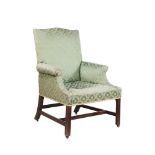 A George III mahogany and upholstered armchair