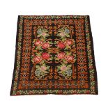 A floral flatweave rug