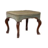 A carved walnut and upholstered stool