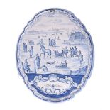 A large Dutch Delft blue and white shaped oval plaque