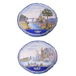 A pair of Dutch Delft polychrome shaped oval horizontal wall-plaques