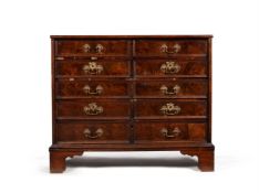 A walnut and olivewood oyster veneered chest of drawers