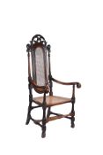 A William & Mary carved fruitwood armchair