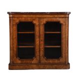 Y A graduated pair of Victorian walnut and tulipwood banded side cabinets