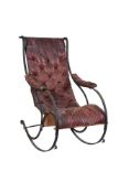 A Victorian cast iron and leather upholstered rocking armchair