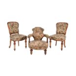 A Victorian walnut and upholstered low armchair