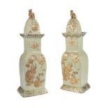 A pair of English Ironstone pale-green ground rectangular section chinoiserie vases and domed covers