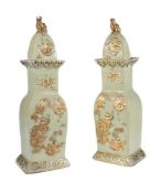 A pair of English Ironstone pale-green ground rectangular section chinoiserie vases and domed covers