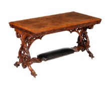 A Victorian carved burr walnut library table