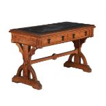 A Reformed Gothic oak and inlaid writing table