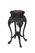 A Chinese carved hardwood and marble inset jardiniere stand