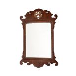 A mahogany and parcel gilt fret framed wall mirror in George III style