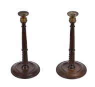 A pair of mahogany and brass candlesticks in George III style