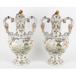 A pair of 19th century French faience large baluster vase and covers in the Moustiers style