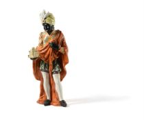 A Continental polychrome painted pottery figure of one of The Three Wise Men