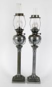 A pair of late 19th century Belgian nickel Corinthian column oil lamps