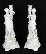 A pair of white glaze Continental candlesticks or candelabra bases