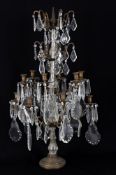 A 19th century Continental patinated metal and cut glass candelabrum