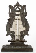 An early 19th century bronze table thermometer