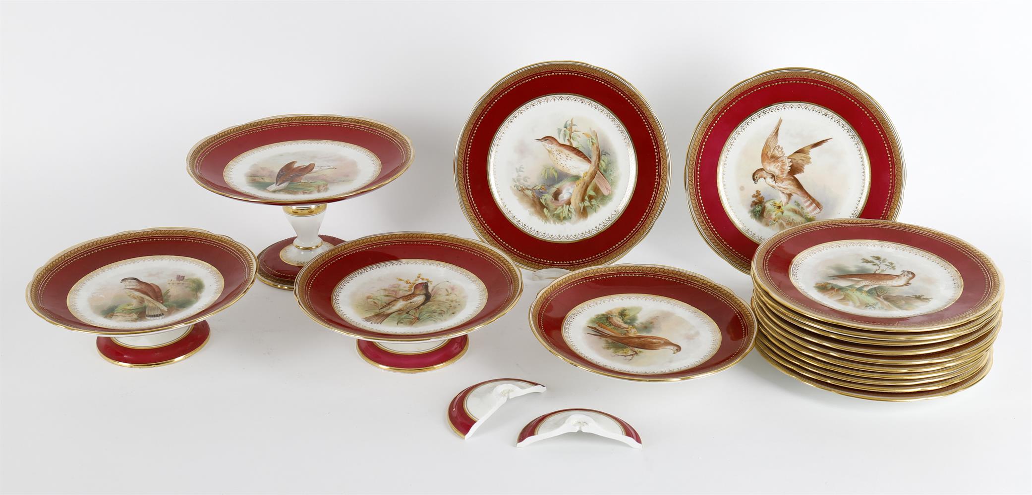 A late 19th century English porcelain claret ground ornithological dessert service